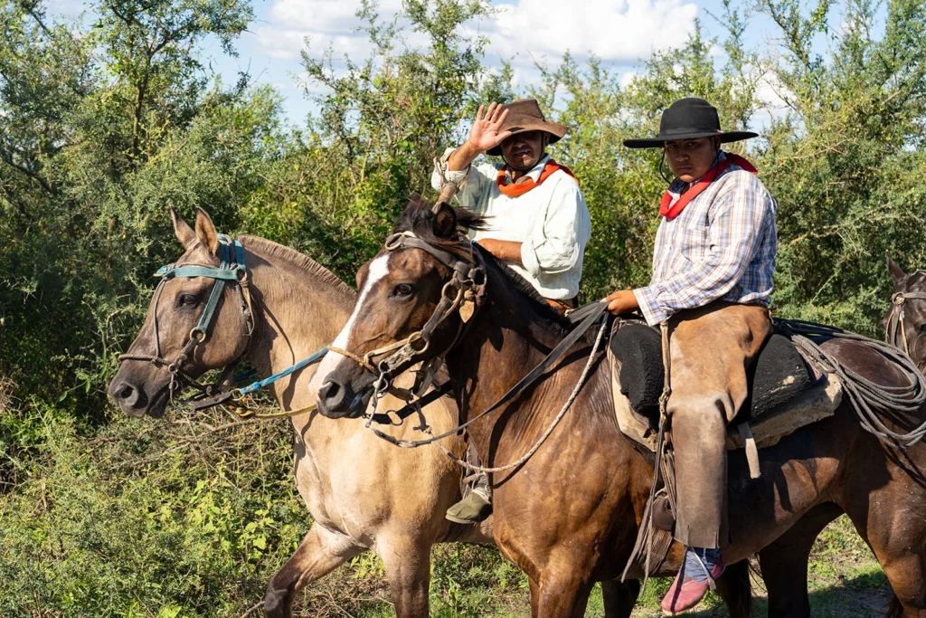 Two gauchos criollo horse riding in Argentina